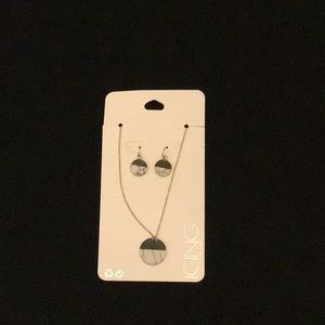 This is a set of a marble necklace and earrings.